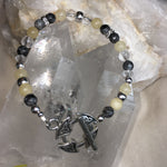 Faceted Clear Quartz, Faceted Black Labradorite, and Yellow Calcite Bracelet with Pewter Triquetra Knot Toggle