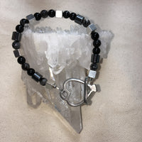 Faceted Black Labradorite, Black Onyx, Black Agate, Hematite Drums, Pewter Cubes, Brass Heart Toggle